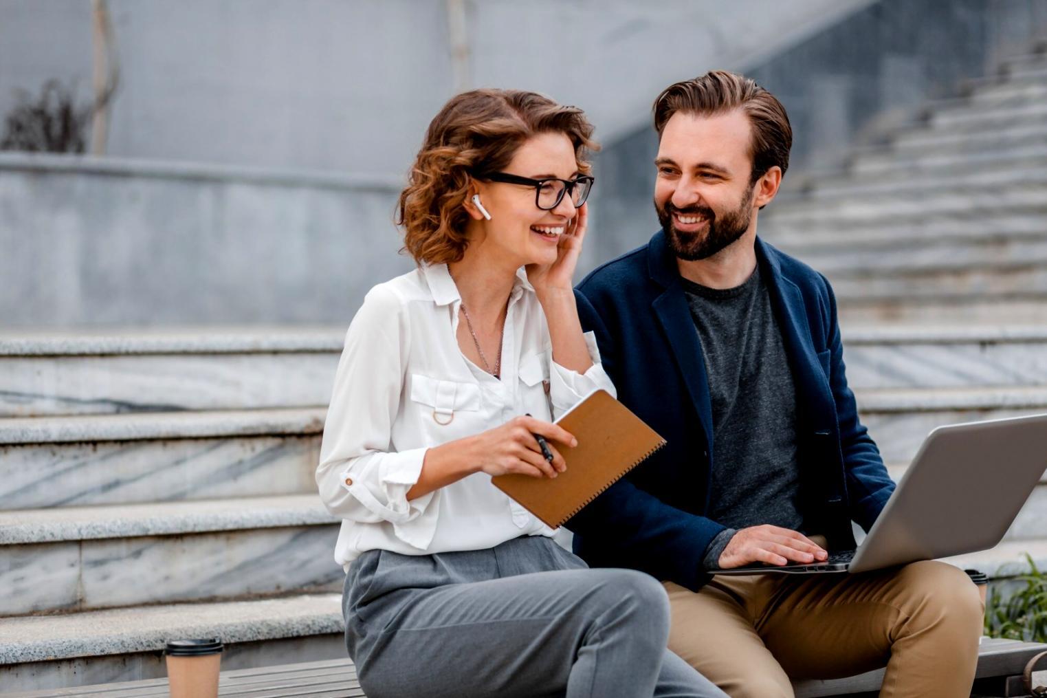 Financial analyst reviewing company reports and data at workspace
